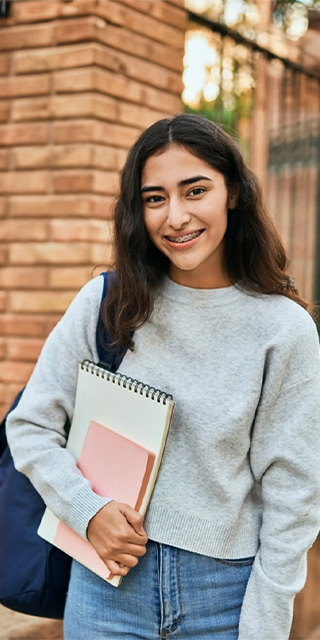 Smiling student outside Gateway building